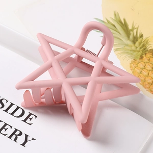 Pink matte star-shaped hair claw clip with hollow design for women's hairstyling