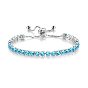 Detail shot of silver adjustable tennis bracelet with round blue cubic zirconia stones