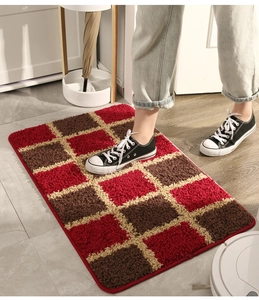 Close-up of durable checkered entryway rug featuring red and brown anti-slip fibers