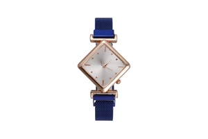 Close-up of diamond-shaped rose gold watch case with blue magnetic mesh strap