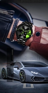 Detail of racing wheel rim dial with green brake calipers and black steel strap on watch