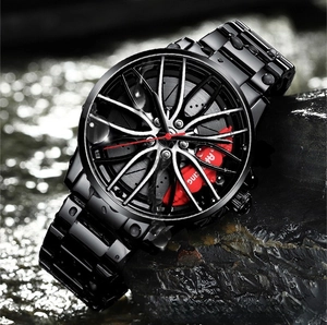 Detail of waterproof racing car wheel watch with metal strap on wet rocks in water