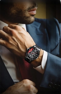 Detail of men's watch with car wheel rim dial design and black stainless steel band