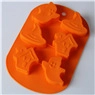 Detailed top view of orange silicone mold with ghost and witch hat Halloween shapes