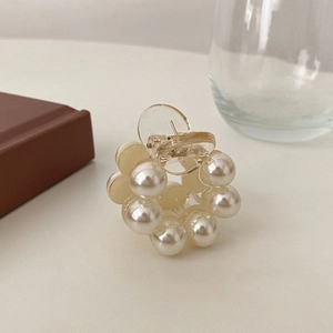 Elegant round pearl hair claw clip with acrylic base for women's hairstyle