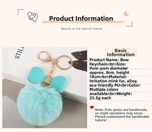 Detail view of 8cm mint green faux rabbit fur pom pom keychain with bow and alloy hook