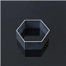 Macro shot of a modern matte black hexagonal geometric ring on a dark reflective surface