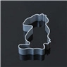 Detailed view of silver Mickey mouse shaped cookie cutter on black reflective surface