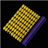 Detailed macro shot of yellow oval embossed cake molds with purple spring handle tool