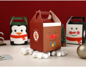 Detailed view of reindeer and snowman themed Christmas apple gift boxes with handles