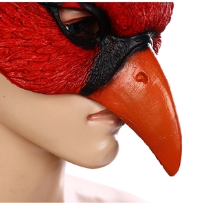 Detail of red cardinal bird mask showing realistic feather texture and vibrant beak