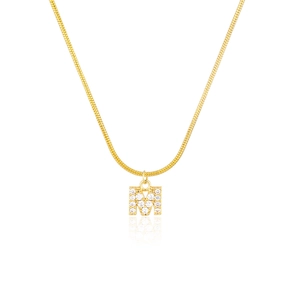 Detail of letter M pendant with sparkling clear crystals on a gold snake chain necklace