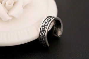 Detail of vintage carved leaf ear cuff in antique silver finish with rustic texture
