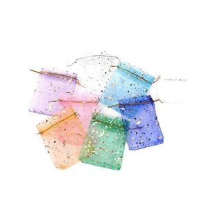 Multicolor organza gift bags with gold star and moon patterns and drawstring closure