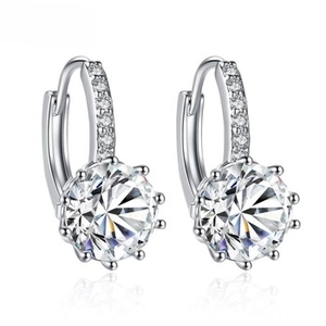 Detail of silver hoop earrings featuring a large eight-prong set round zircon and pavé stones