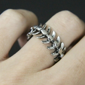 Vintage antique silver fishbone dragon ring in alloy metal shown on model's hand
