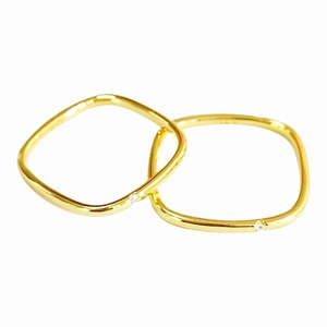 Minimalist gold titanium steel square ring set with tiny zircon stones on white background