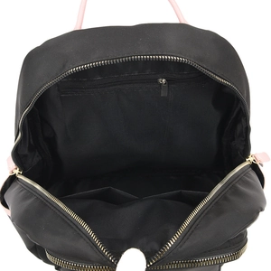 Internal view of black oxford backpack with pink handles and organized interior pockets