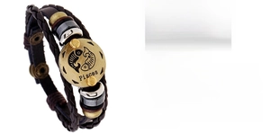 Detail view of woven leather Pisces zodiac bracelet with vintage brass charm and adjustable strap