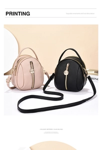 Detail of mini backpacks in black and pink with lychee texture and rose charm