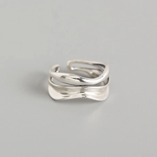 Macro shot of silver S925 sterling silver ring with minimalist wavy double-layer design