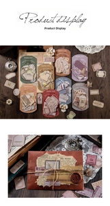Detail of vintage gold-stamped stationery stickers on a dark wood background