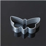 Detailed view of silver butterfly-shaped metal cookie cutter on a black reflective surface