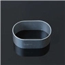 Detailed view of grey oval-shaped plastic cookie cutter on a black reflective surface