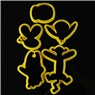Detail of yellow Mickey-shaped plastic cookie cutters and fondant molds on black background