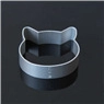 Detailed top view of a silver cat-shaped metal cookie cutter on a black background