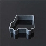 Detailed view of a grey car-shaped cookie cutter for baking on a dark reflective surface