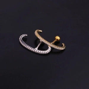 Polished stainless steel C-shape tragus studs with zircon inlays in gold and silver