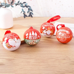Detail of Christmas tinplate ornament set with festive patterns and red silk lanyards