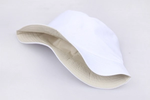 Detailed top view showing the white exterior and beige lining of the fabric bucket hat