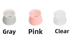 Close-up of silicone furniture leg protectors in gray, pink, and transparent colors