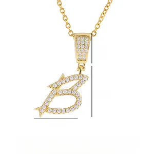 Detailed view of gold 'B' letter pendant with zircon pave and size measurements
