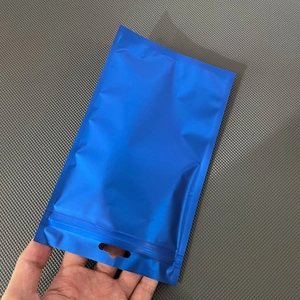 Detail of blue matte aluminum foil zip lock bag with hang hole for small accessories