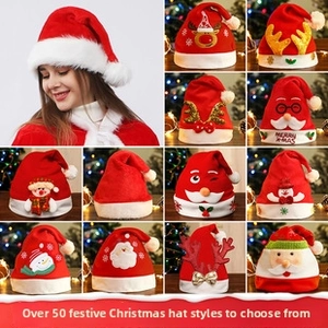 Detail showing various plush Christmas hats with Santa, reindeer and snowman designs