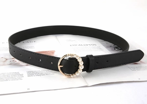 Close-up of black PU leather belt featuring a gold circular buckle with pearl accents