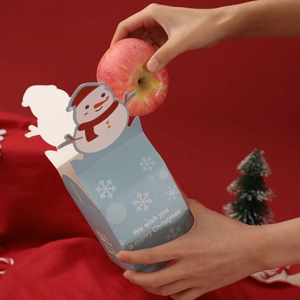 Blue Christmas apple gift box with a snowman topper and festive snowflake patterns
