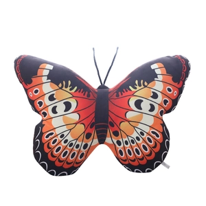Vibrant orange butterfly plush pillow with realistic wing patterns on white background