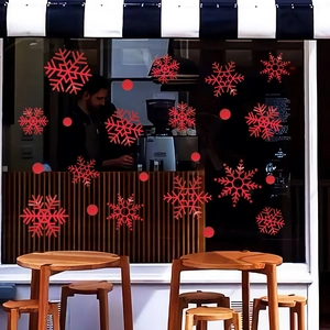 Christmas gold snowflake and dot window stickers on shop glass for festive decoration
