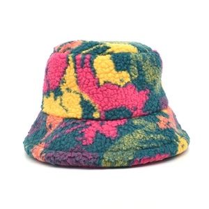 Detailed view of colorful fleece bucket hat with pink yellow and green patchwork fabric