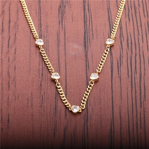 Punk style 18k gold heart link necklace featuring flat cuban chain with clear crystal stones
