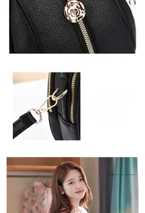 Detail of lychee pattern leather saddle bag with gold rose zipper and shoulder strap