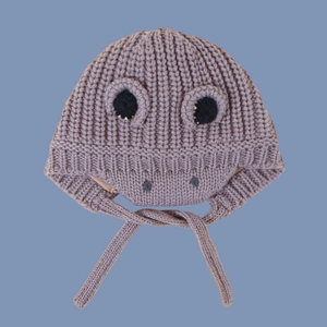 Detailed macro view of purple knit dinosaur hat texture and protective earflaps