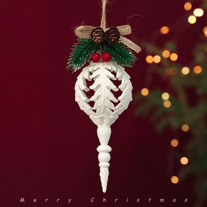 Christmas tree hanging ornament with pine cones, red berries, and bow on red background