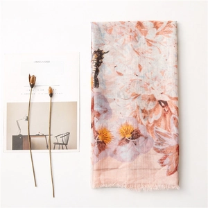 Lightweight cotton linen shawl with pink seahorse and floral prints and frayed edges