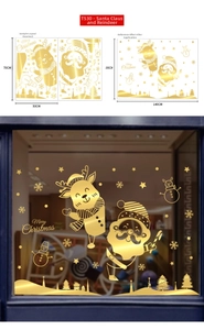 Detailed view of golden Christmas window decals with Santa Claus and reindeer designs