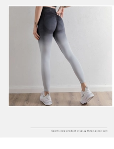 Detail of high waisted seamless yoga pants with gradient grey color and scrunch butt effect